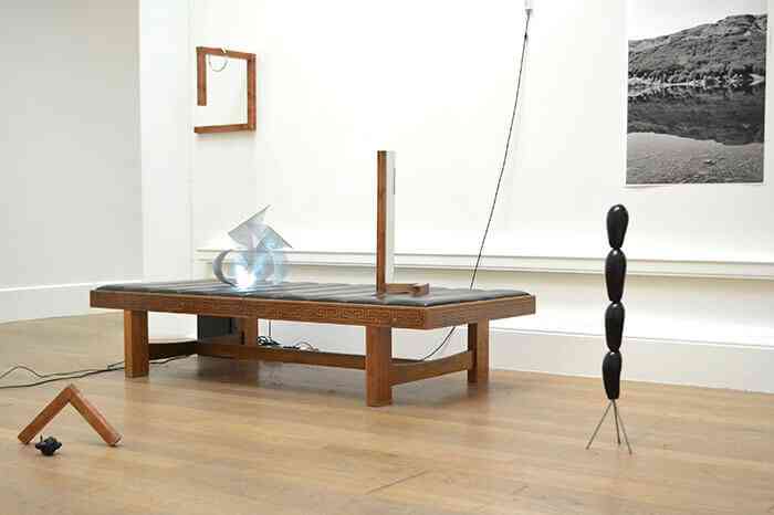 alexander_millar_wave_2013_installation_view_metal_wood_leather_lights_aubergines_mirror_looped_video_print_2